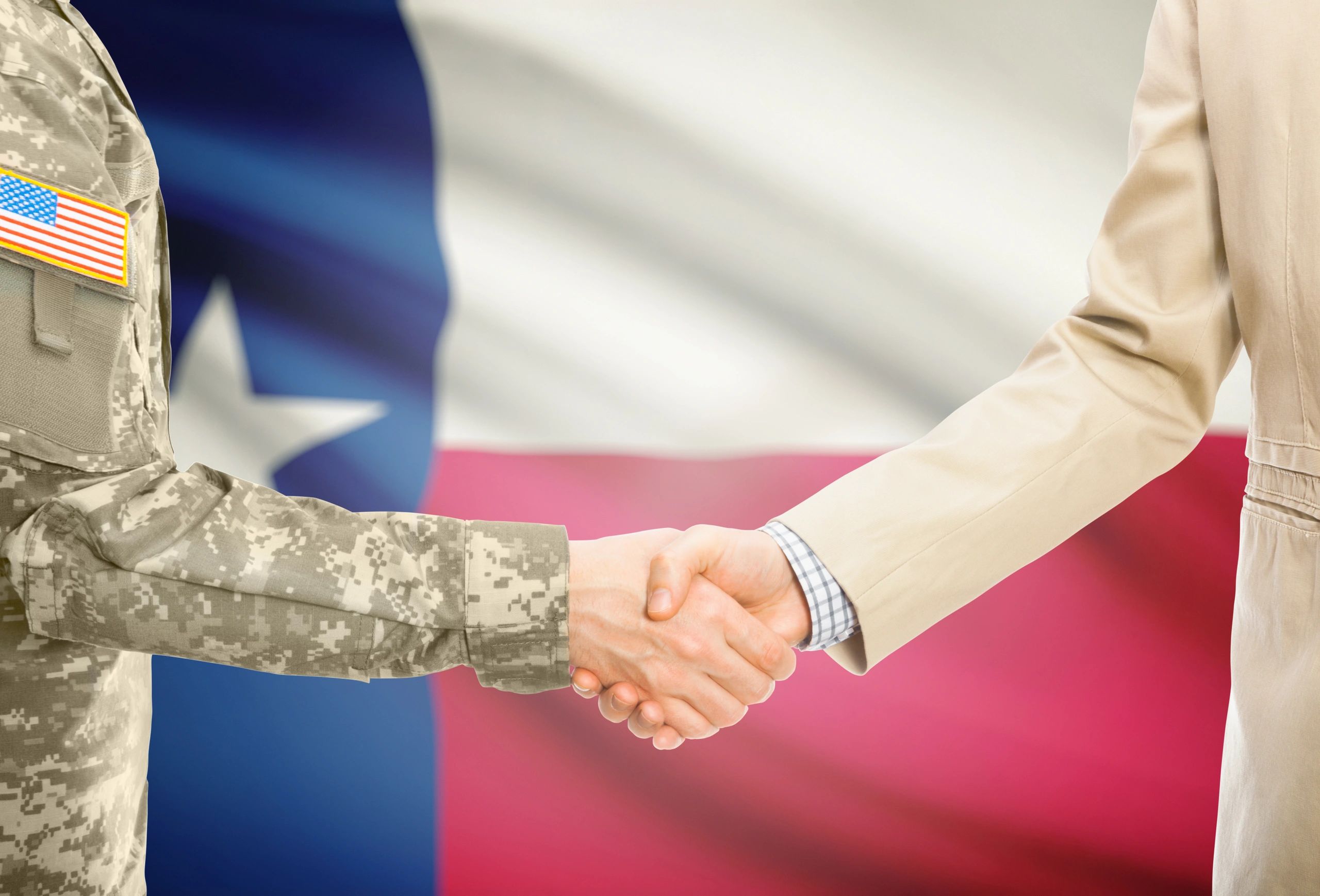 business people handshake office Texas